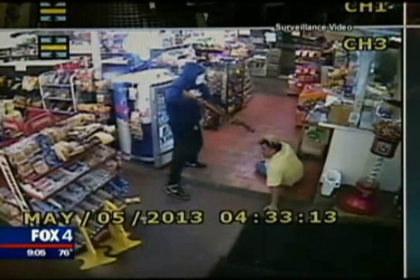 Surveillance video obtained by FOX 4 TV shows a store employee being held at gunpoint, at...