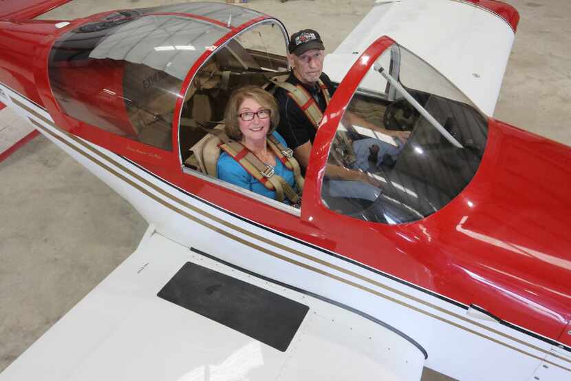 Susan Aronow and Rick Aronow with their single-engine plane. The plane, a Van's RV-7A...
