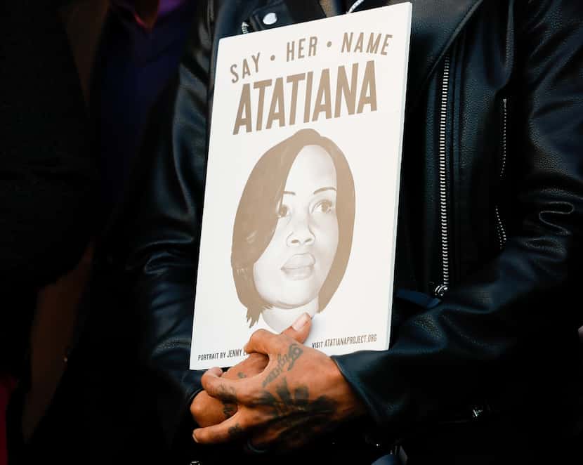 A poster with Atatiana Jefferson’s name and face and text, including, “Say her name,” is...