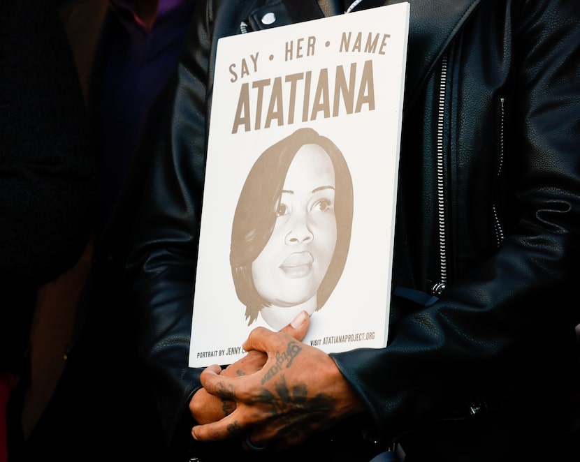 A poster with Atatiana Jefferson’s name and face and text, including, “Say her name,” is...