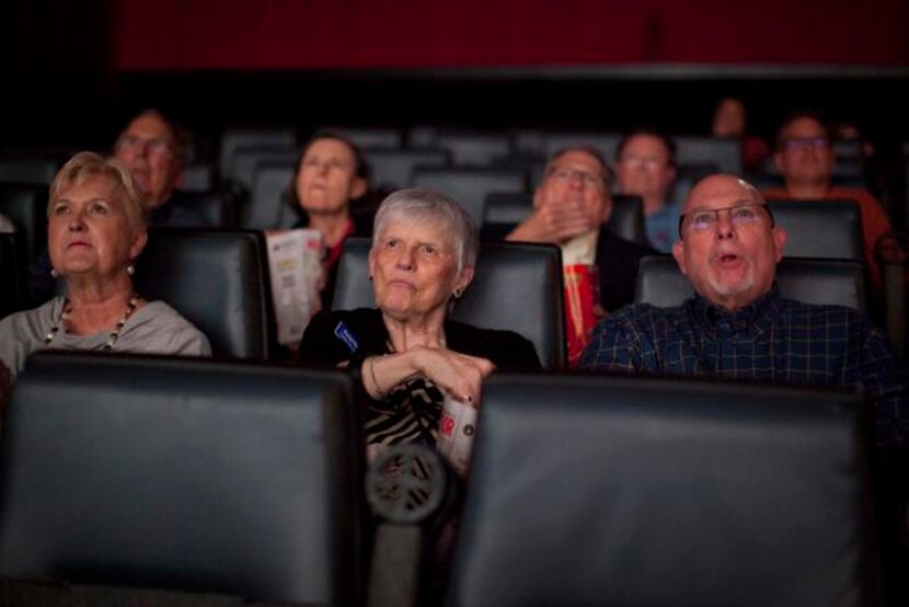 
From left: Phyllis Waddle, Rachel Flake and Rick Cloud watch a movie during the Capital...