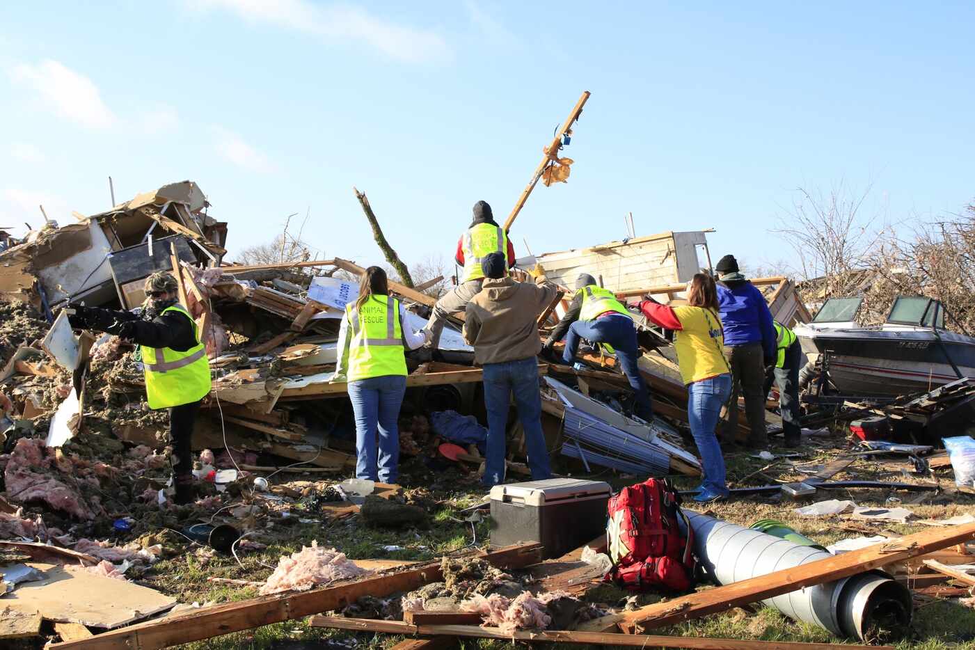 Animal rescue team members search in the neighborhood ravaged by tornadoes in Rowlett in 2015.