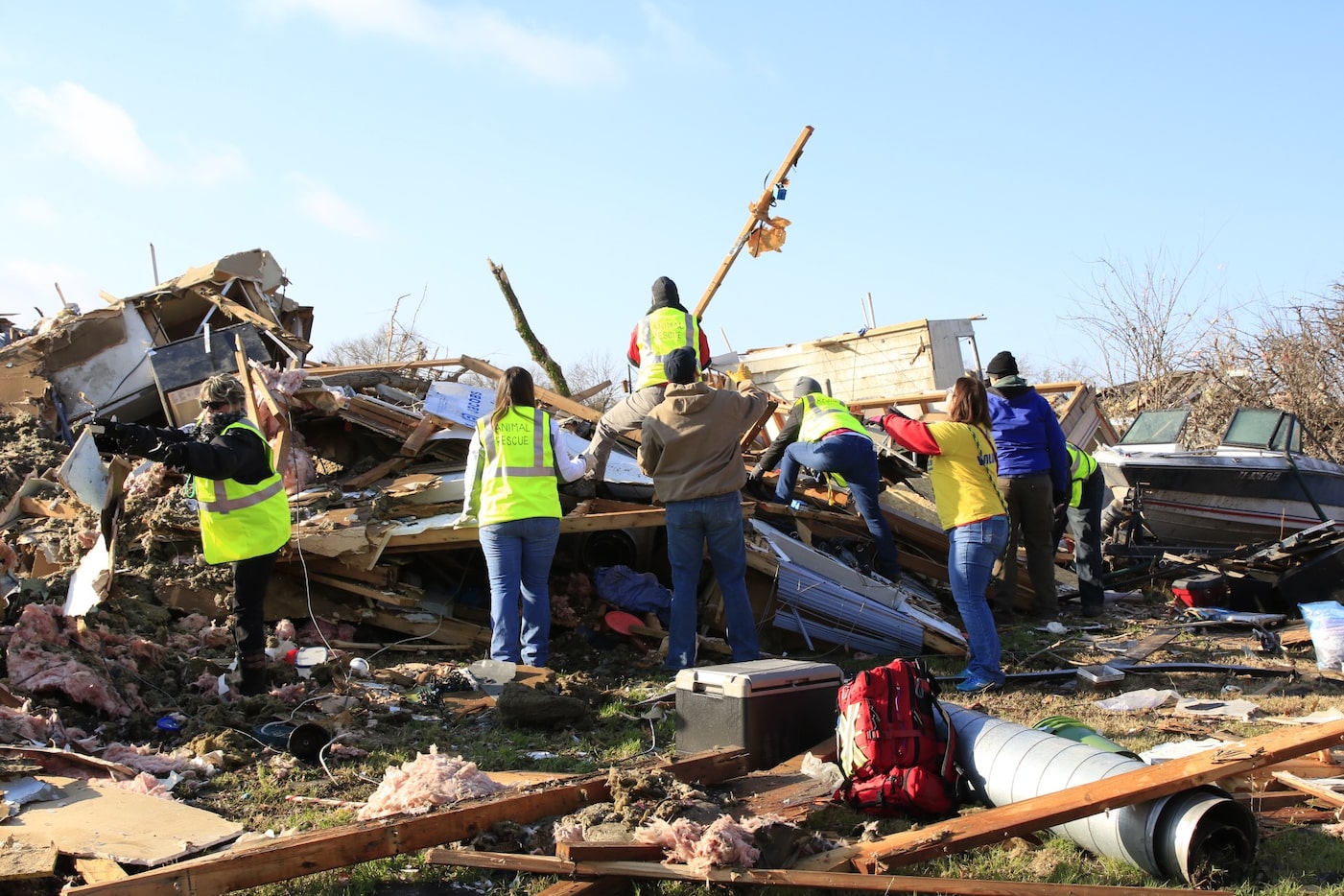 Animal rescue team members search in the neighborhood ravaged by tornadoes in Rowlett in 2015.