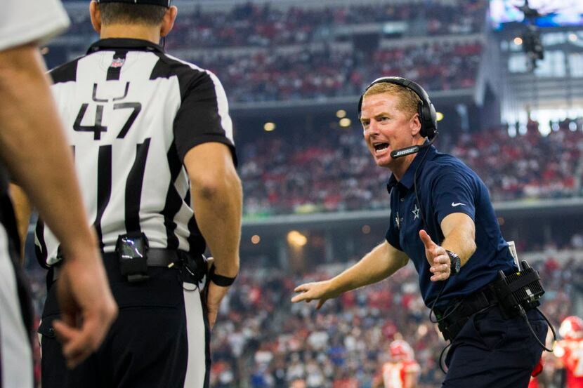 Dallas Cowboys head coach Jason Garrett disputes a call during the first quarter of an NFL...