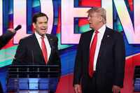 Republican presidential candidates Sen. Marco Rubio and Donald Trump chat during a...