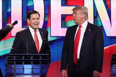 Republican presidential candidates Sen. Marco Rubio and Donald Trump chat during a...