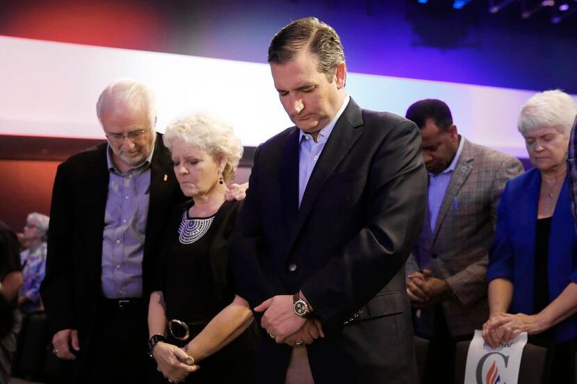 Sen. Ted Cruz prayed at an Iowa rally   with Dick and Betty Odgaard, who closed their...