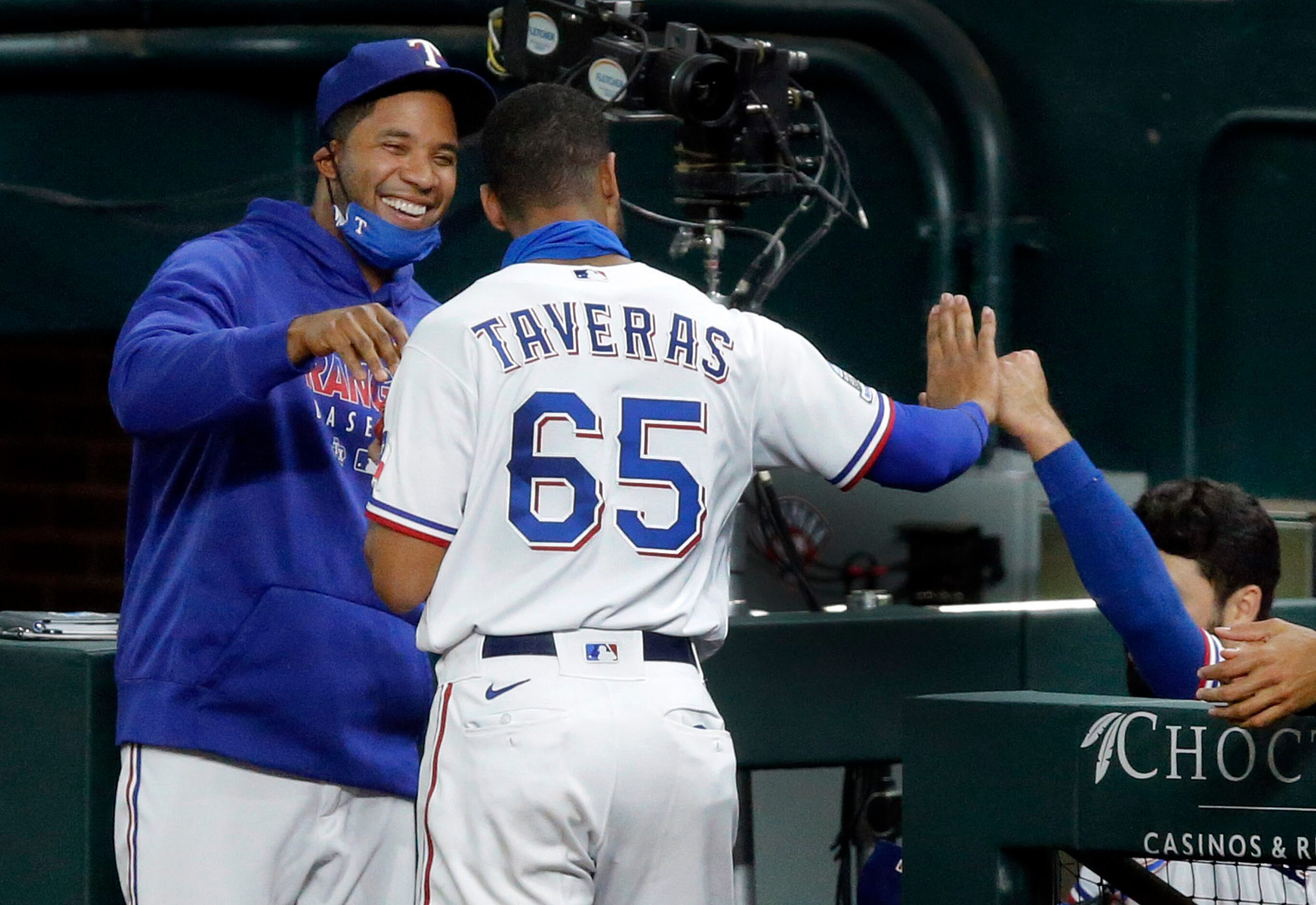 Texas Rangers center fielder Leody Taveras (65) is congratulated by teammates Elvis Andrus...