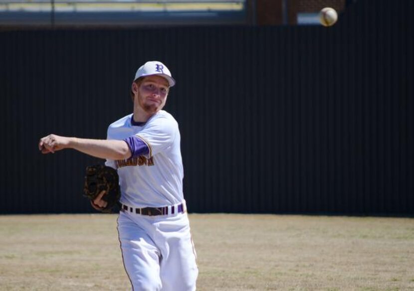 Austin Bowden, 16, first baseman on the Richardson High School varsity baseball team, warms...