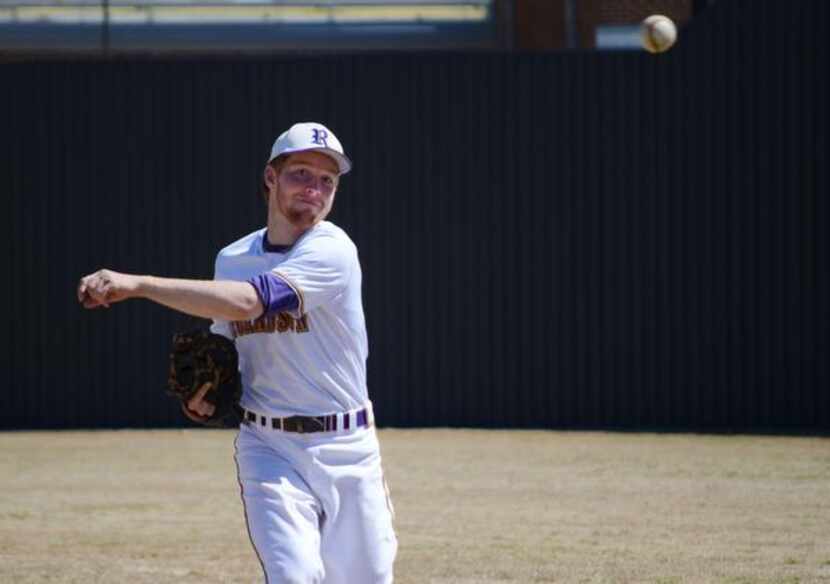 Austin Bowden, 16, first baseman on the Richardson High School varsity baseball team, warms...