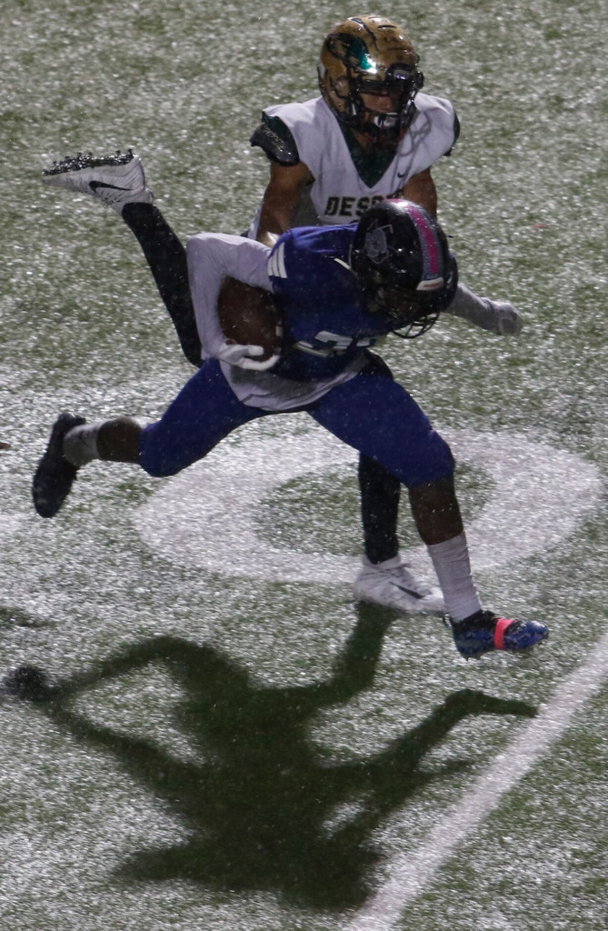 Mansfield Summit defender Ahmaad Moses (23) steps in front of DeSoto receiver Lawrence...