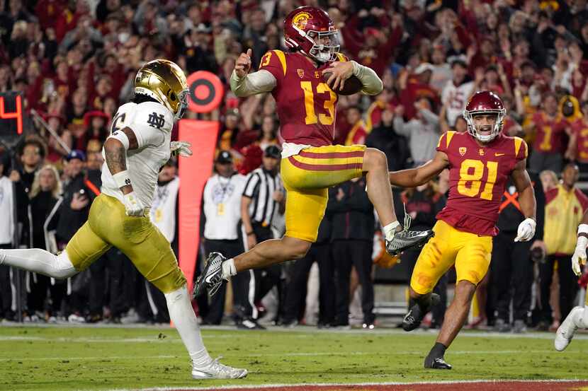 FILE - Southern California quarterback Caleb Williams jumps in for a touchdown as Notre Dame...