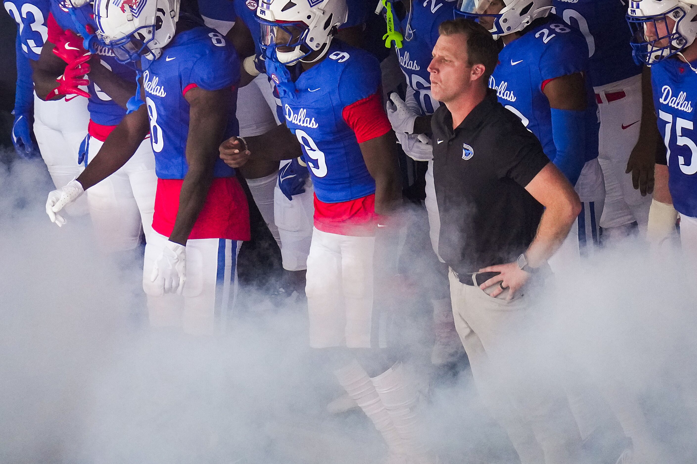 SMU head coach Rhett Lashlee waits with his players to take the field before an NCAA...