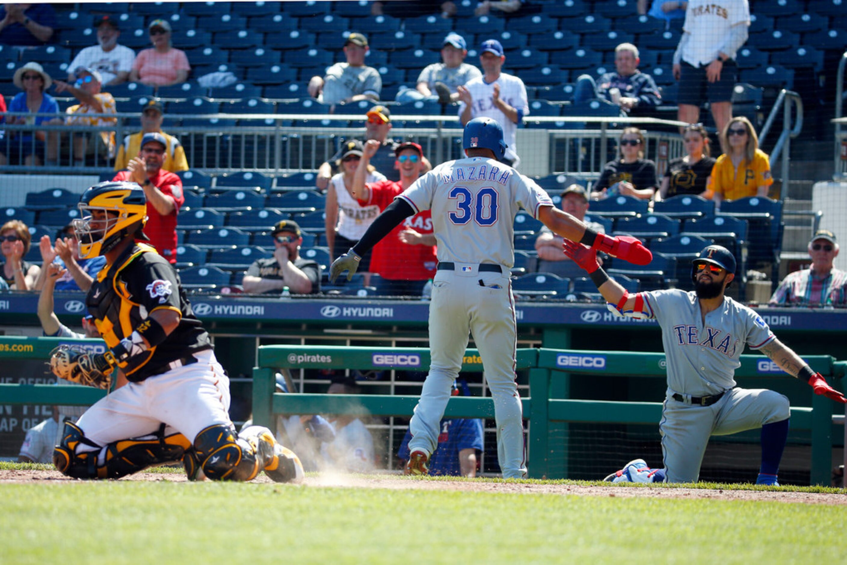 PITTSBURGH, PA - MAY 08:  Nomar Mazara #30 of the Texas Rangers scores and celebrates with...