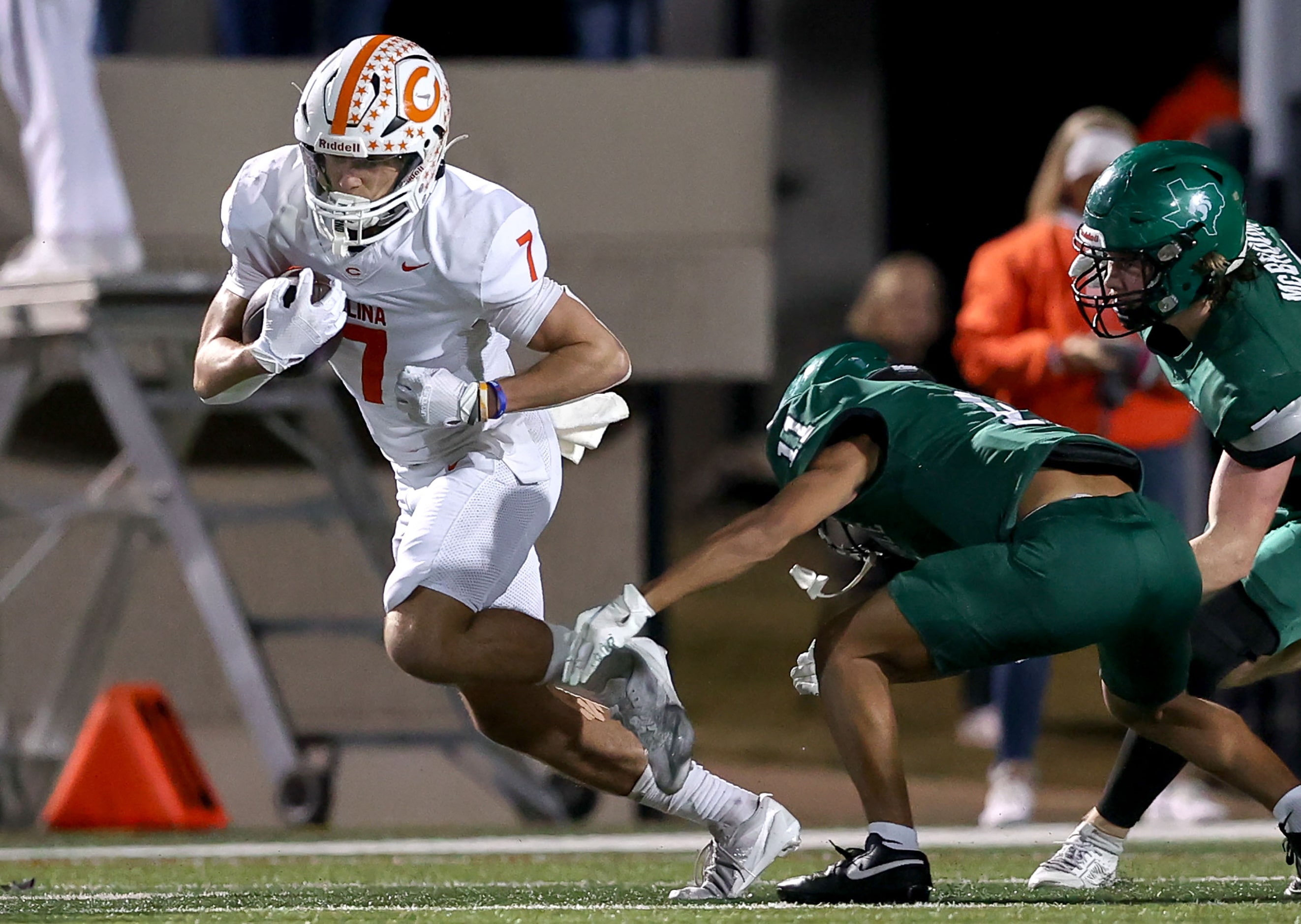 Celina running back Harrison Williams (7) tries to avoid Kennedale linebacker Gavin Godley...