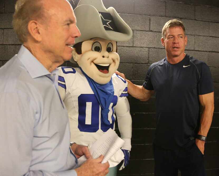 Roger Staubach, Dallas Cowboys mascot "Rowdy" and Troy Aikman visited during the filming of...