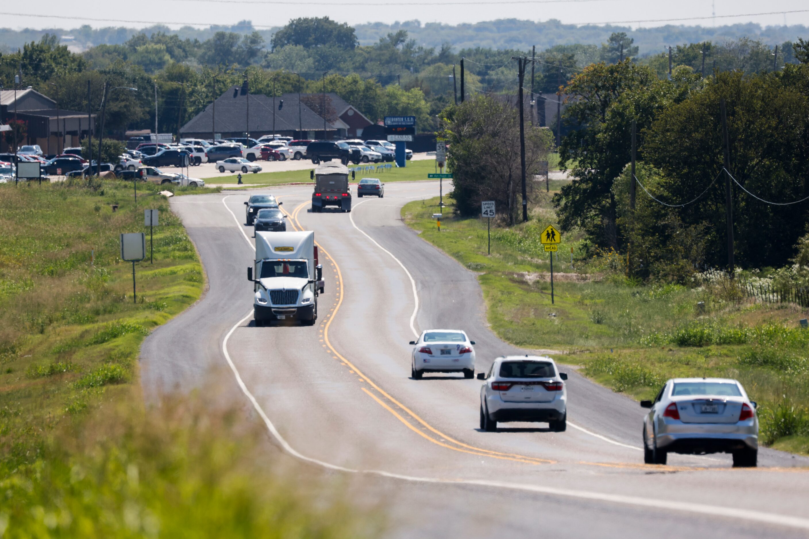 Traffic passes along Preston Road in Gunter on Sept. 13.