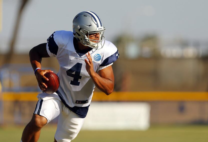 Dallas Cowboys quarterback Dak Prescott (4) rolls out looking for a receiver during...