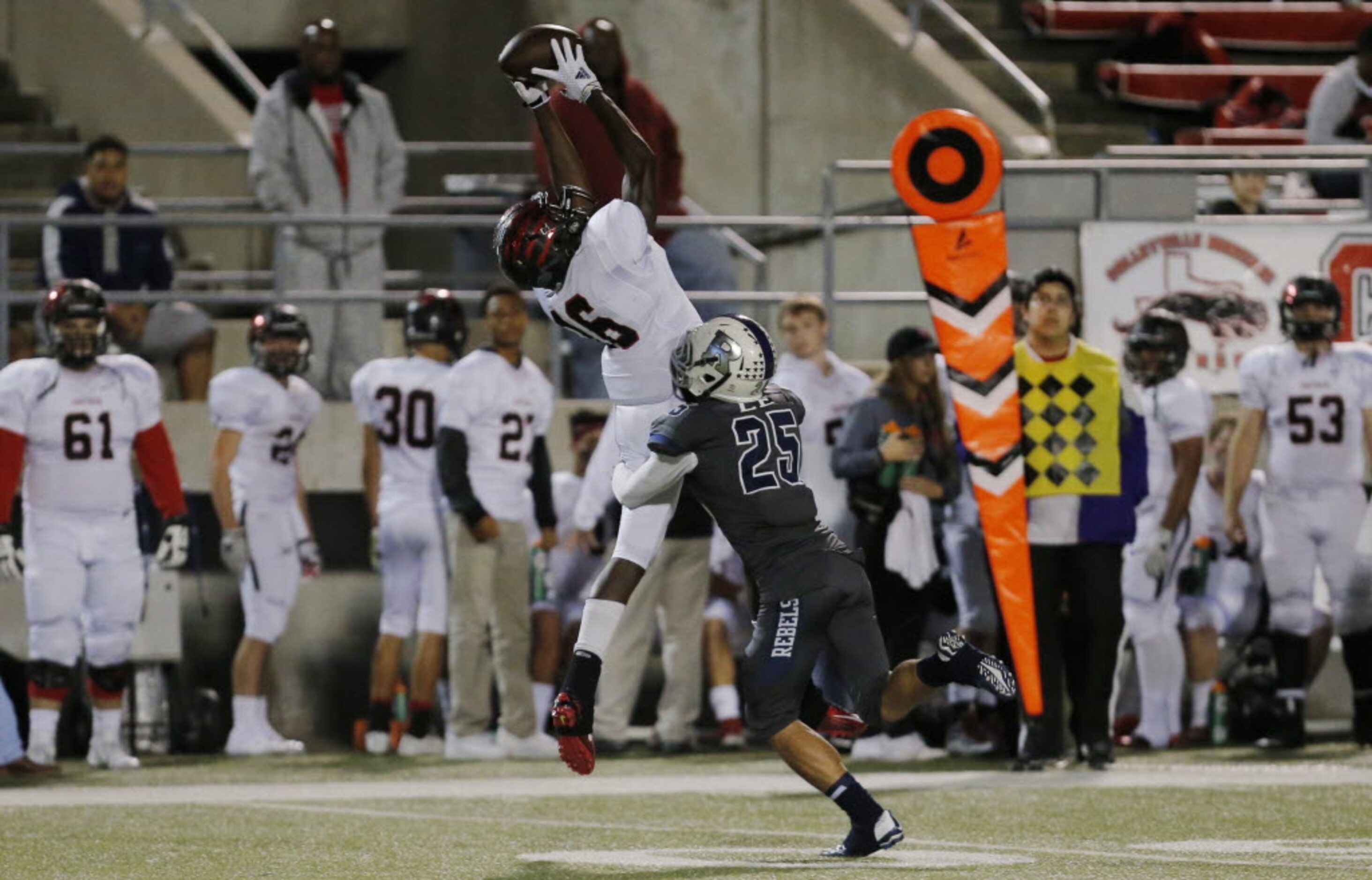 Colleyville Heritage junior wide receiver Germon Thothion (16) catches a pass as Richland's...