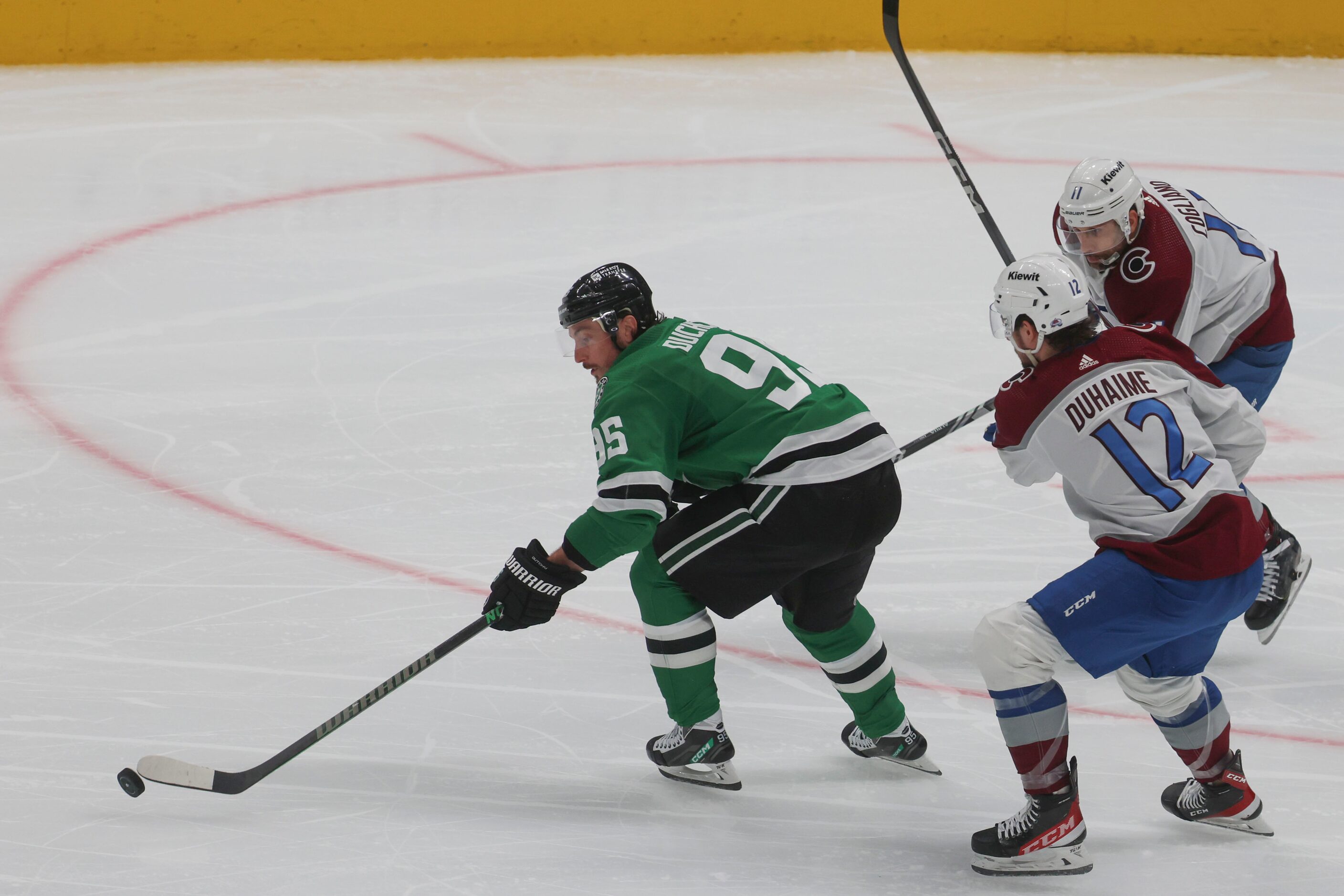 Dallas Stars center Matt Duchene (left) defends the puck against Colorado Avalanche center...