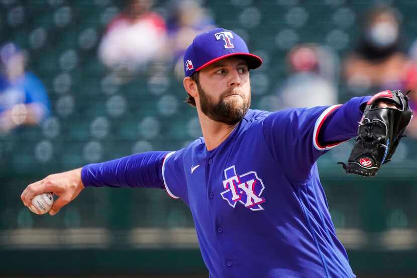 Texas Rangers pitcher Jordan Lyles delivers during the third inning of a spring training...