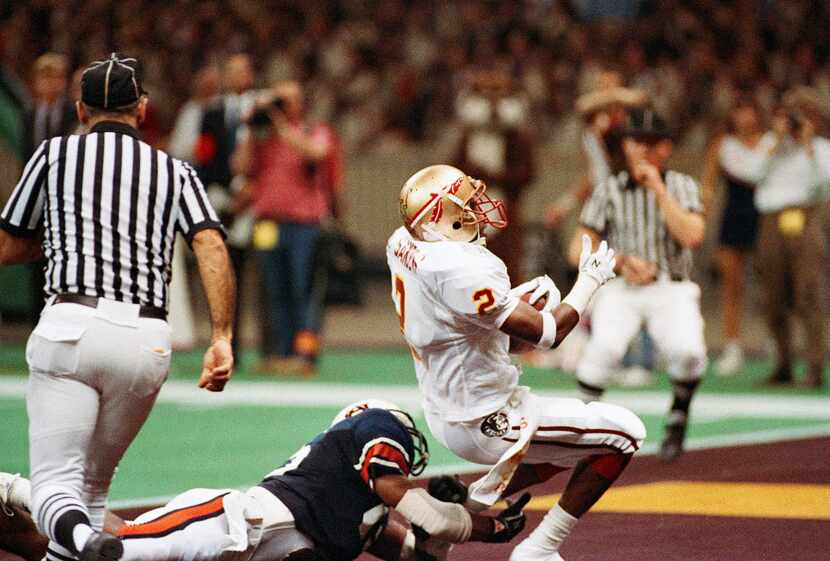 Florida States Deion Sanders (2) intercepts a fourth quarter Reggie Slack pass to Lawyer...