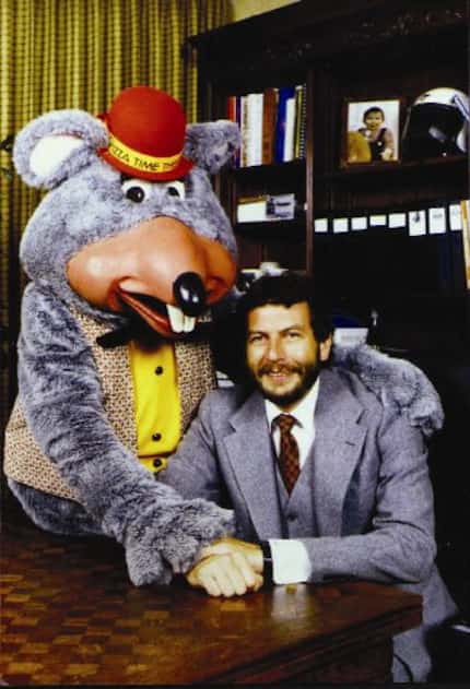 Chuck E. Cheese founder Nolan Bushnell with the Chuck E. Cheese character.