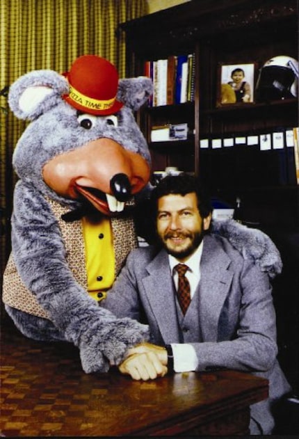 Chuck E. Cheese founder Nolan Bushnell with the Chuck E. Cheese character.