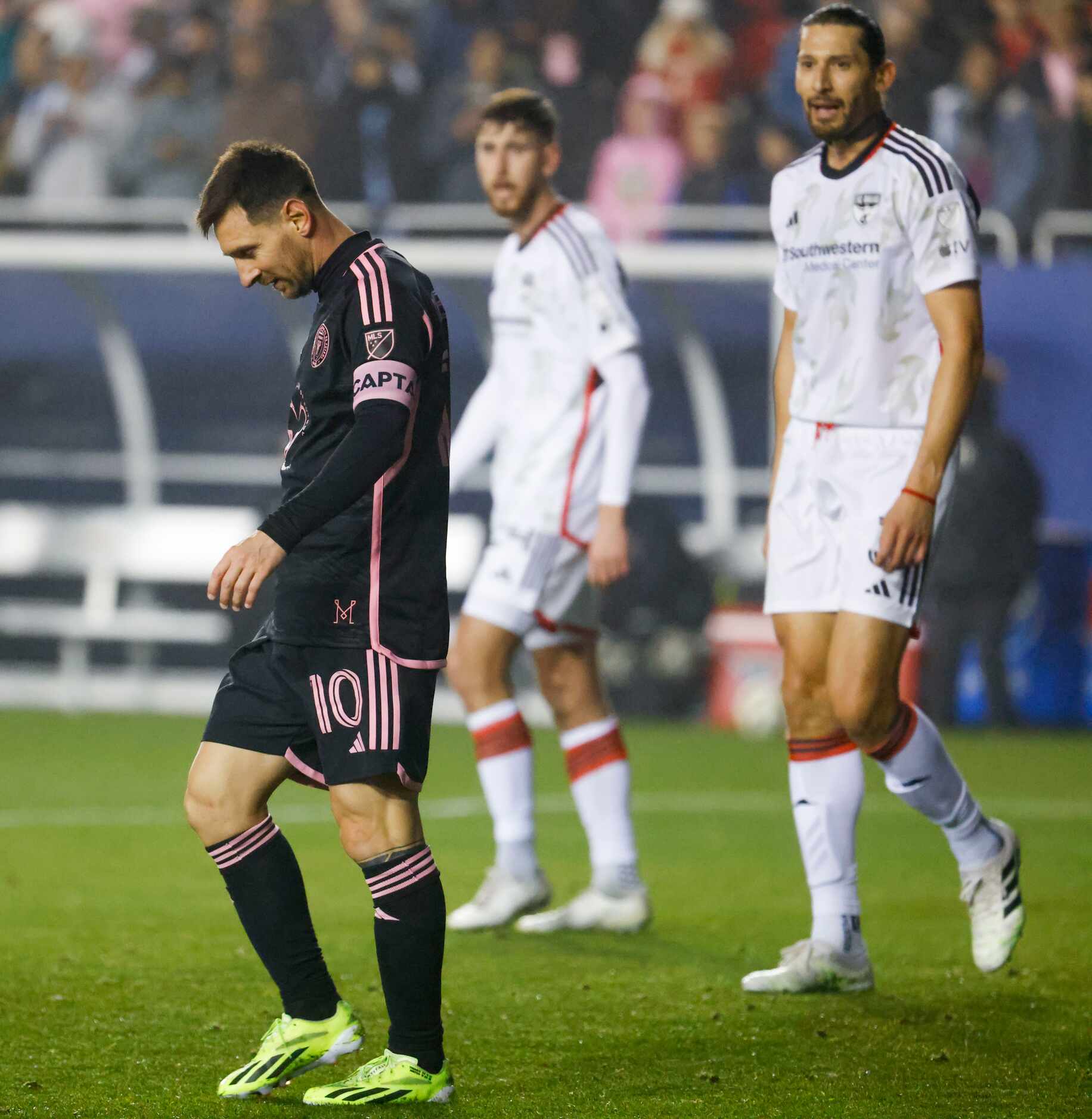 Inter Miami forward Lionel Messi (left) looks down after missing to score as FC Dallas...