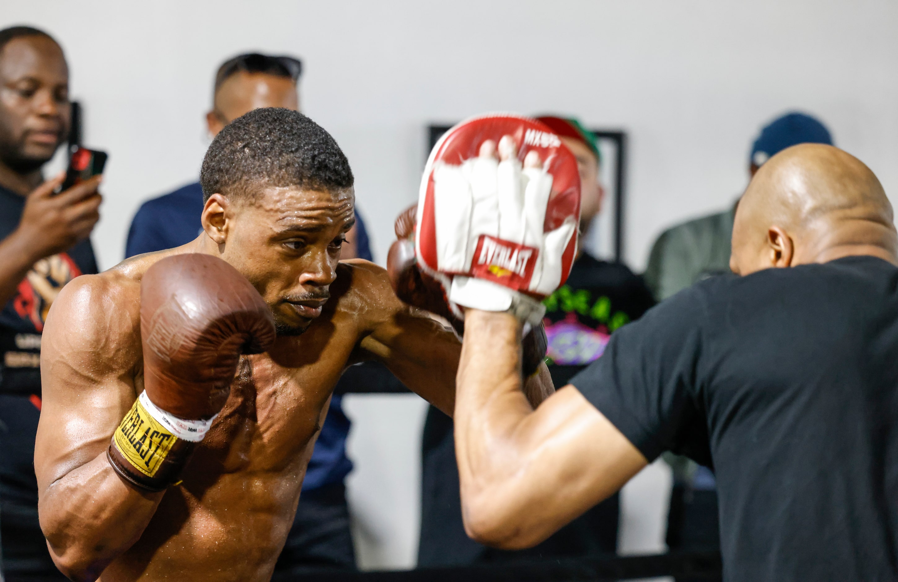 Errol Spence Jr. of Desoto, left, practices with his coach Derrick James during a media...