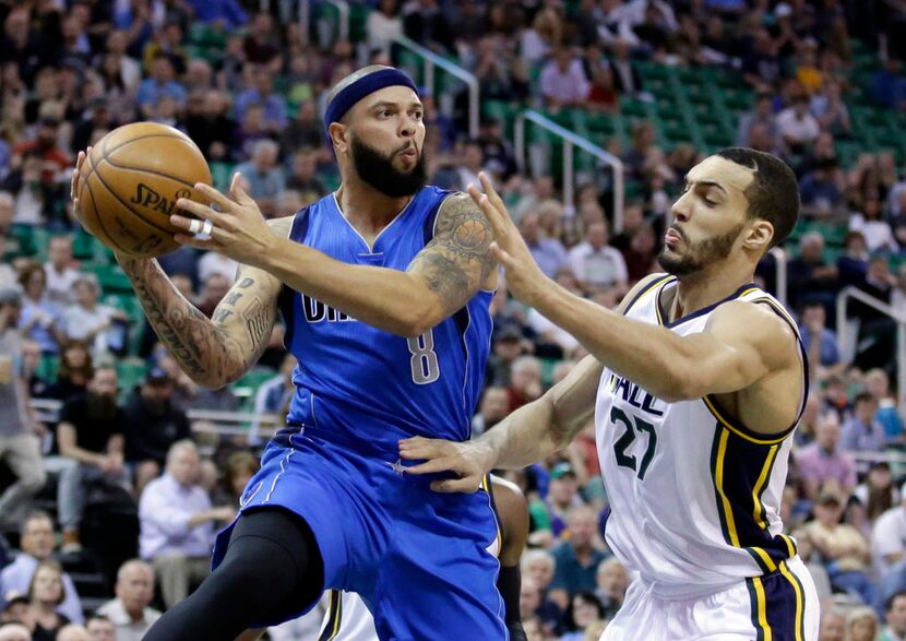 Dallas Mavericks guard Deron Williams (8) passes the ball as Utah Jazz center Rudy Gobert...