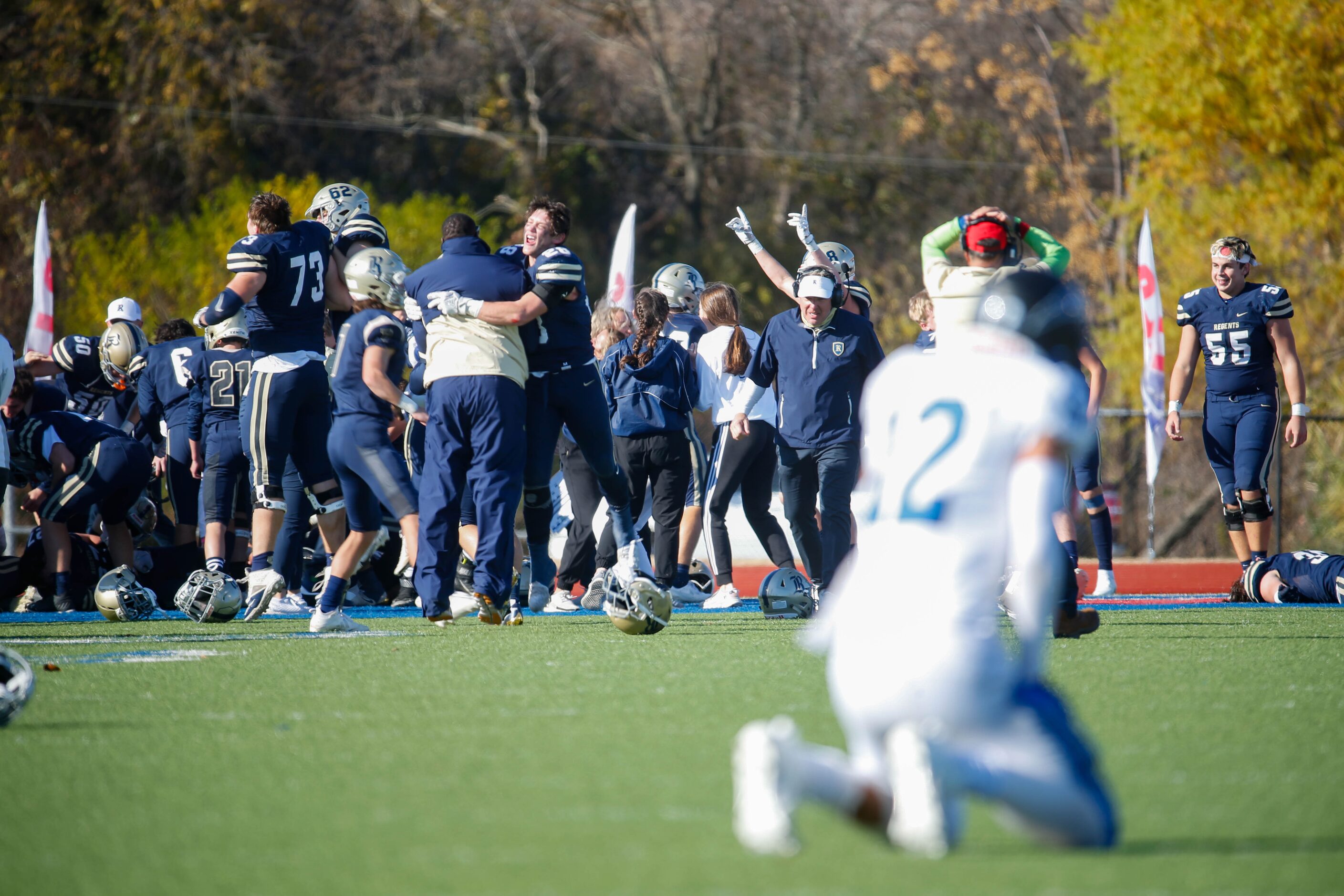 Austin Regents players celebrate in the end zone after Benedict Buerkle (15) game winning...