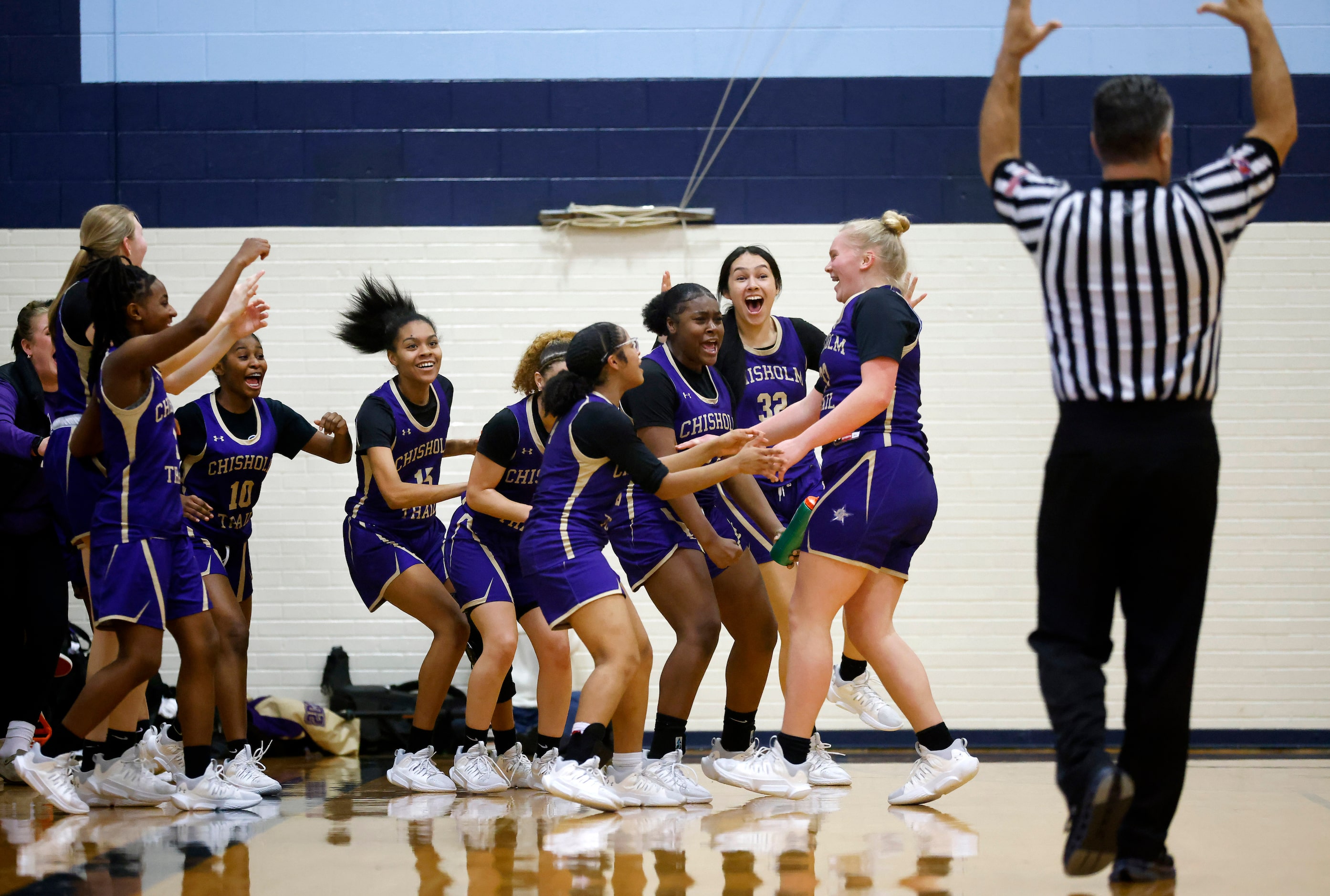 Saginaw Chisholm Trail’s Mikayla Mercer (right) is congratulated by teammates after scoring...