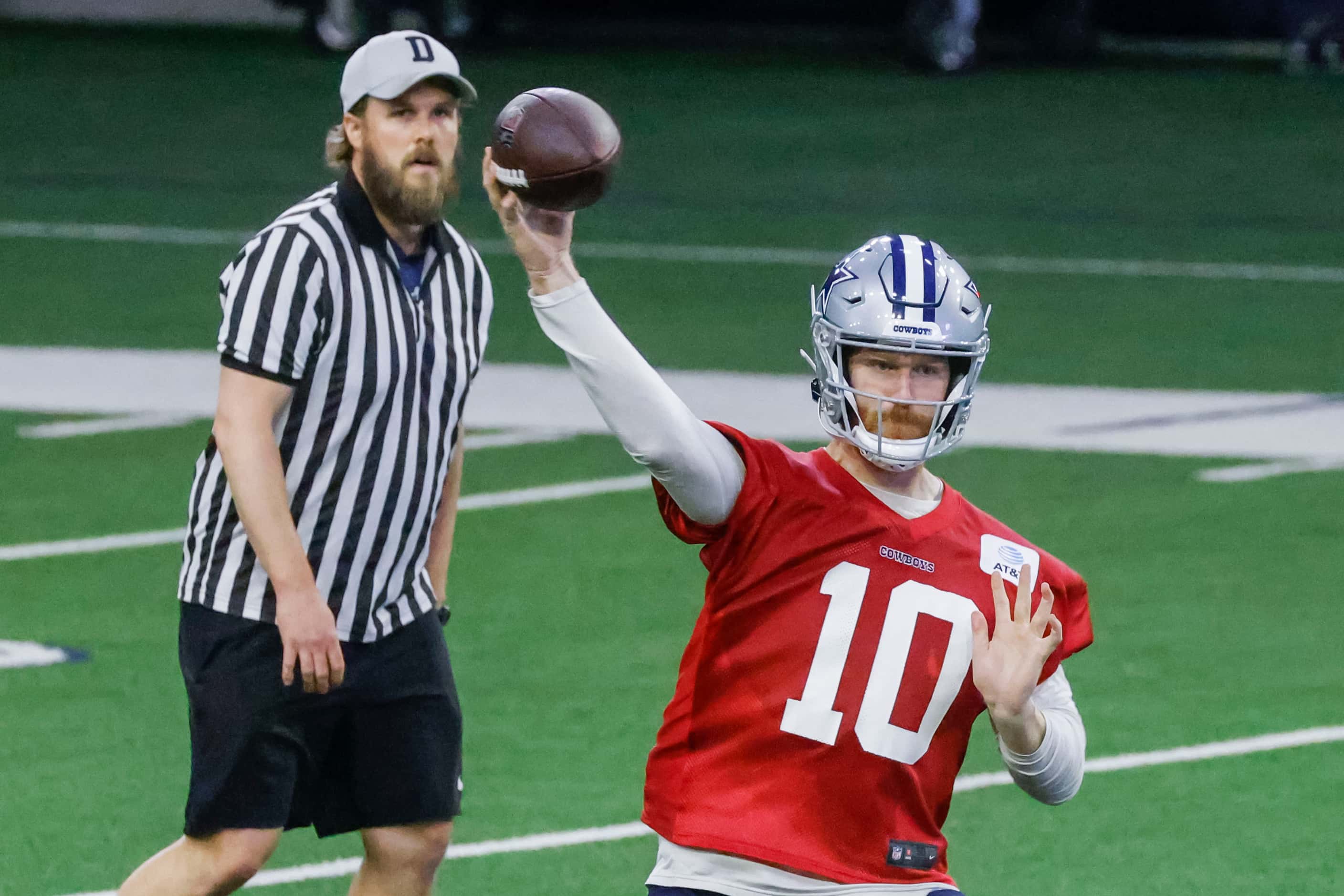 Dallas Cowboys quarterback Cooper Rush throws the ball during OTA practice on Thursday, May...