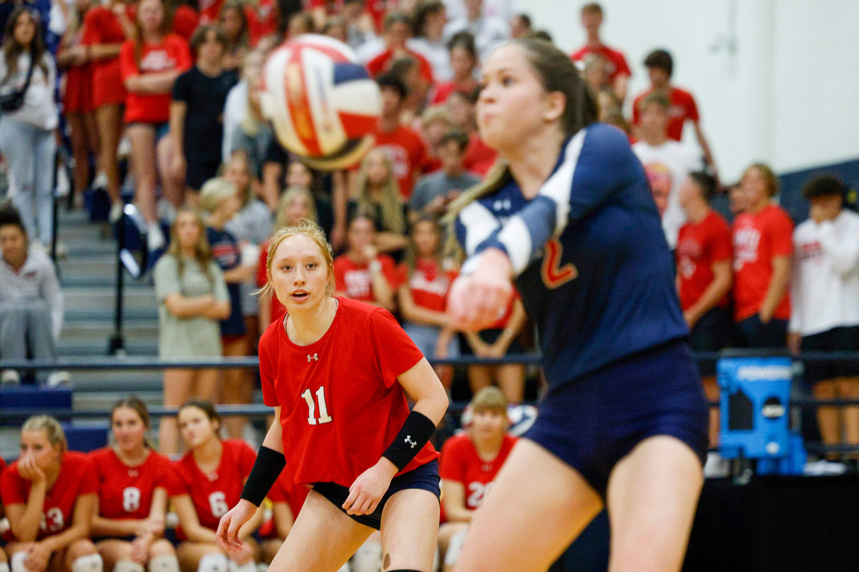 McKinney Boyd’s Ale Romo (11) watches as teammate Kali Vanderhoof (2) digs the ball during a...