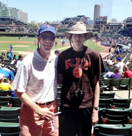 Sports writer Ivan Maisel with his son Max at Wrigley Field.