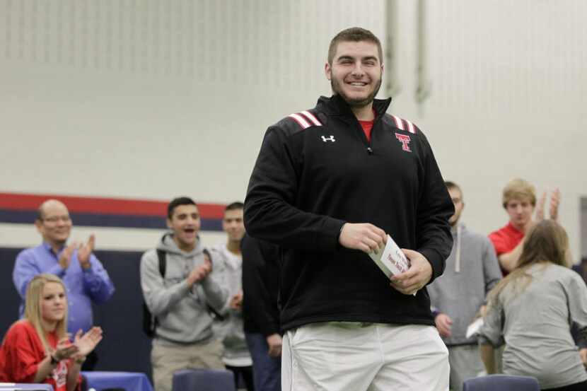 Allen offensive lineman Cody Wheeler signing with Texas Tech is all smiles as he makes his...