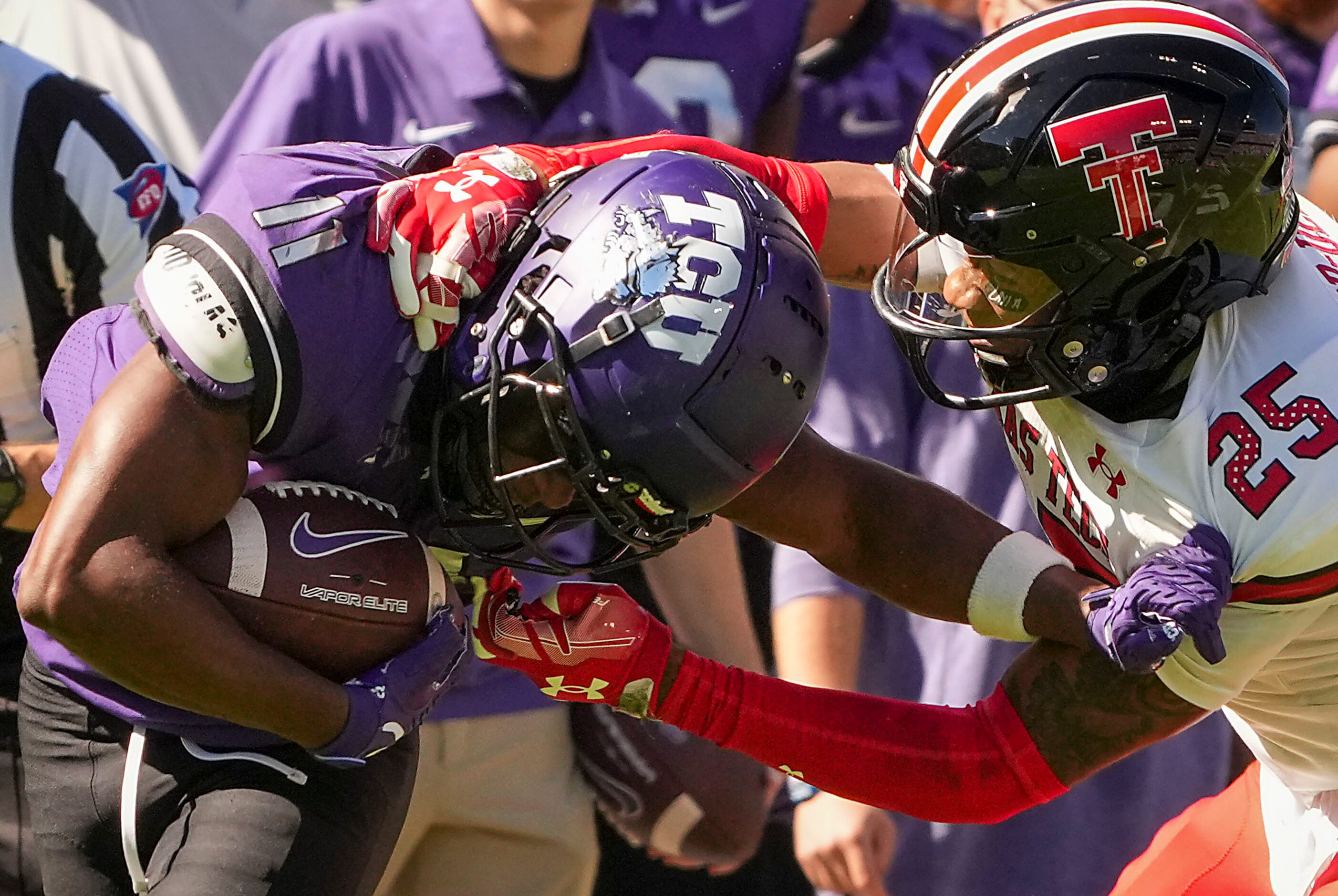 TCU wide receiver Derius Davis (11) is brought down by Texas Tech defensive back Dadrion...