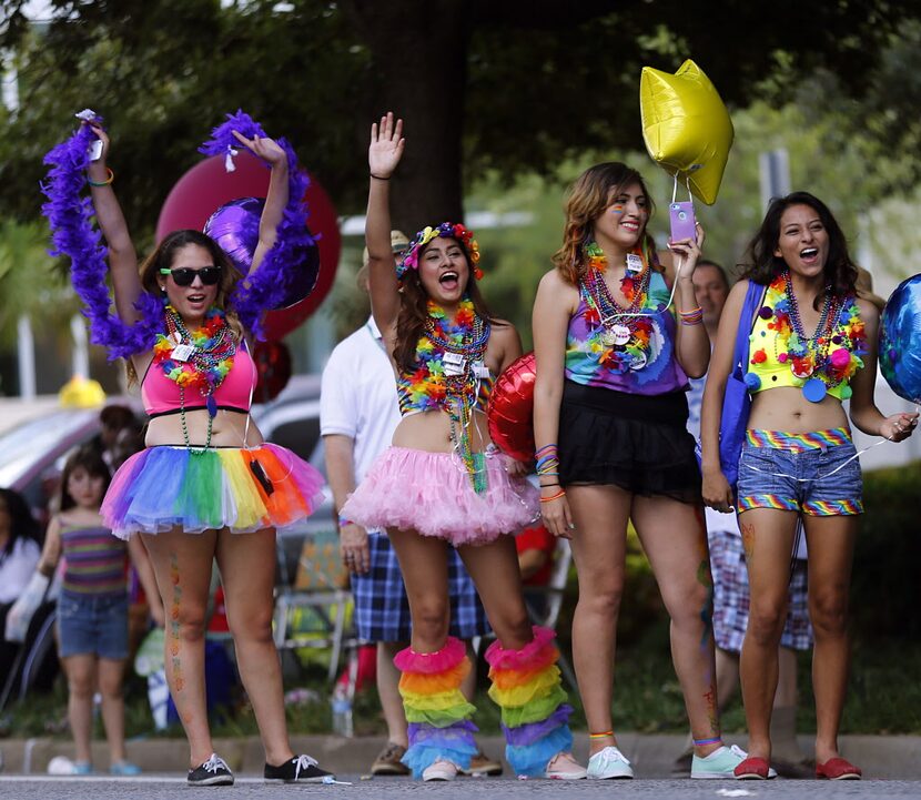 A group of spectators cheer during the Alan Ross Texas Freedom Parade on Cedar Springs Rd....