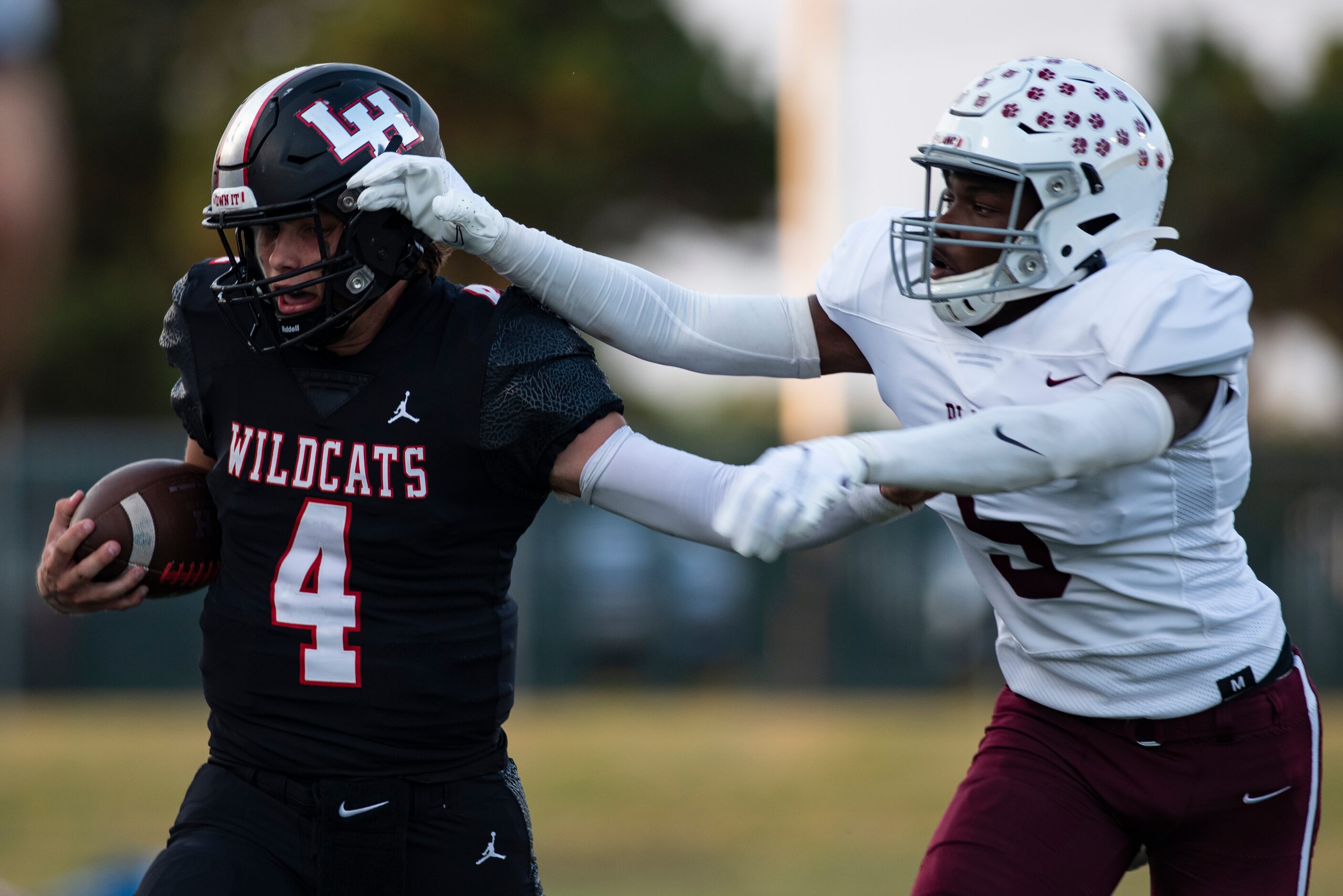 Lake Highlands senior Caden Dotson (4) is tackled after gaining yardage during Lake...