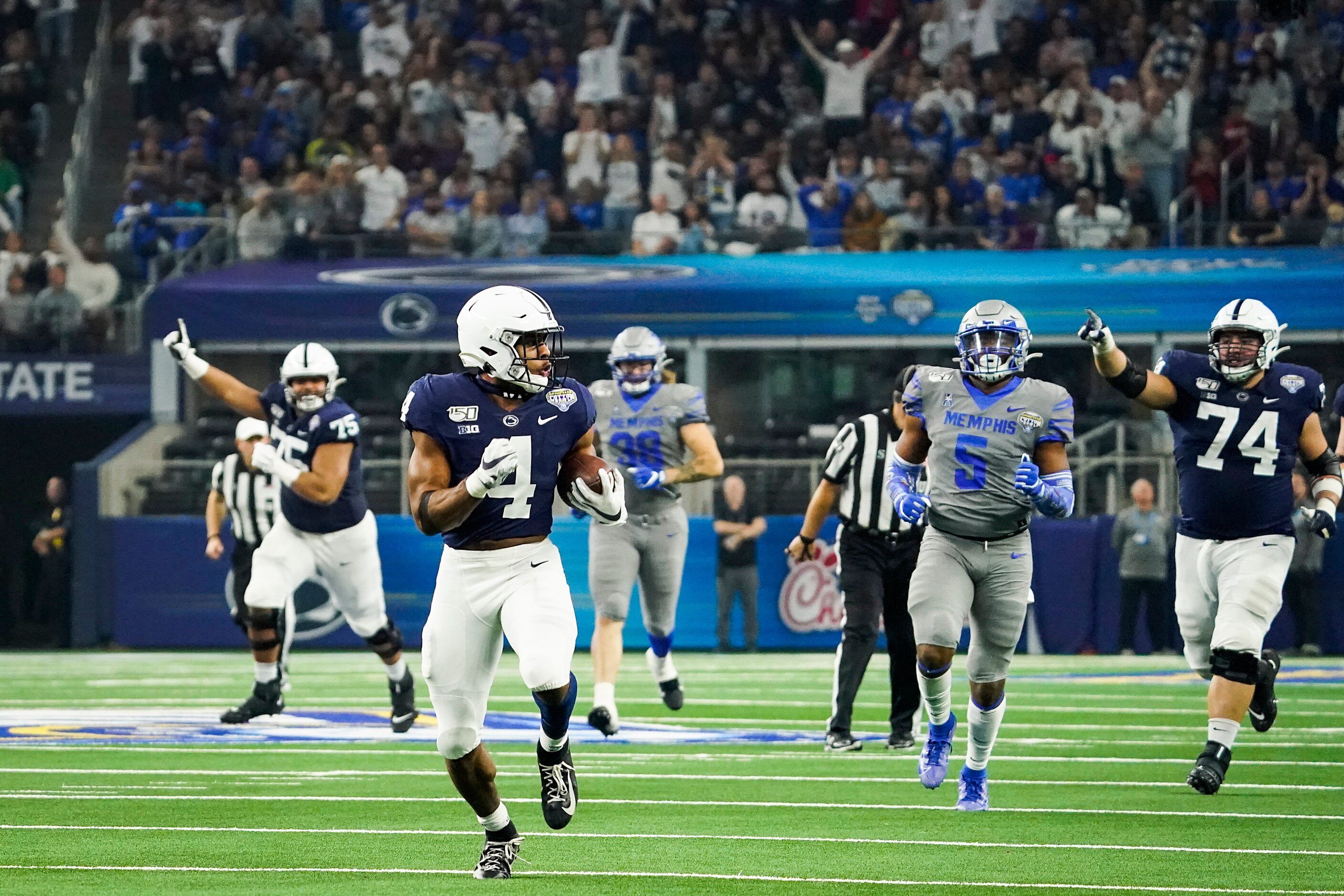 Penn State running back Journey Brown (4) races past the Memphis defense on a 56-yard...