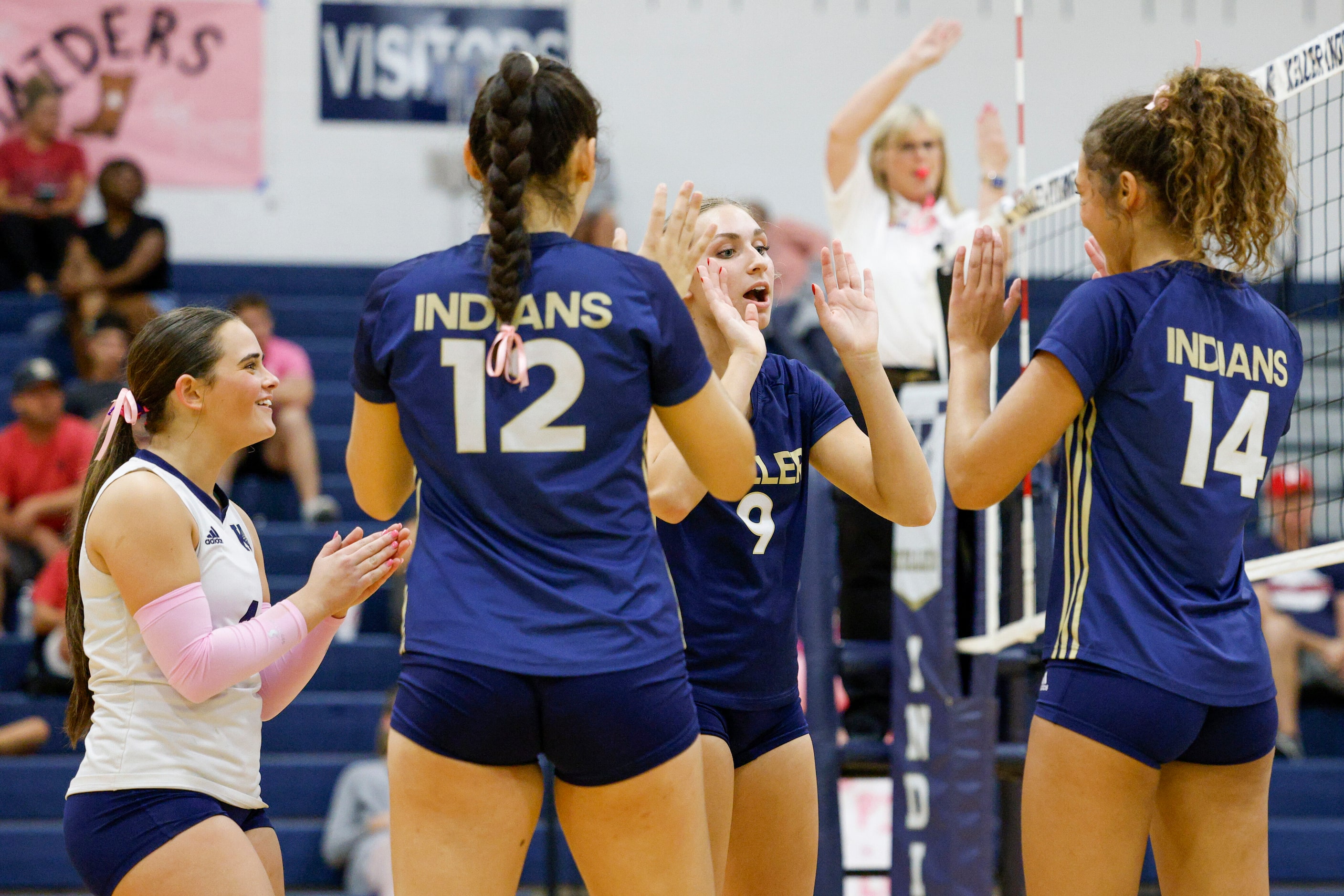 Keller's Lilly Boatner (9) celebrates a point with Lauren Scheiden (left), Anna Flores (12)...