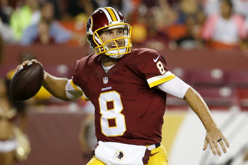 FILE - In this Aug. 20, 2015, file photo, Washington Redskins quarterback Kirk Cousins (8)...