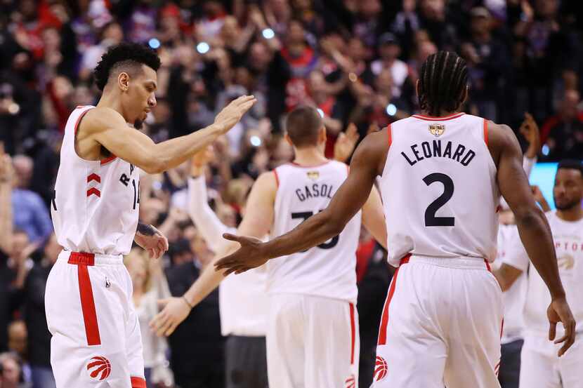 TORONTO, ONTARIO - MAY 30:  Danny Green #14 and Kawhi Leonard #2 of the Toronto Raptors...