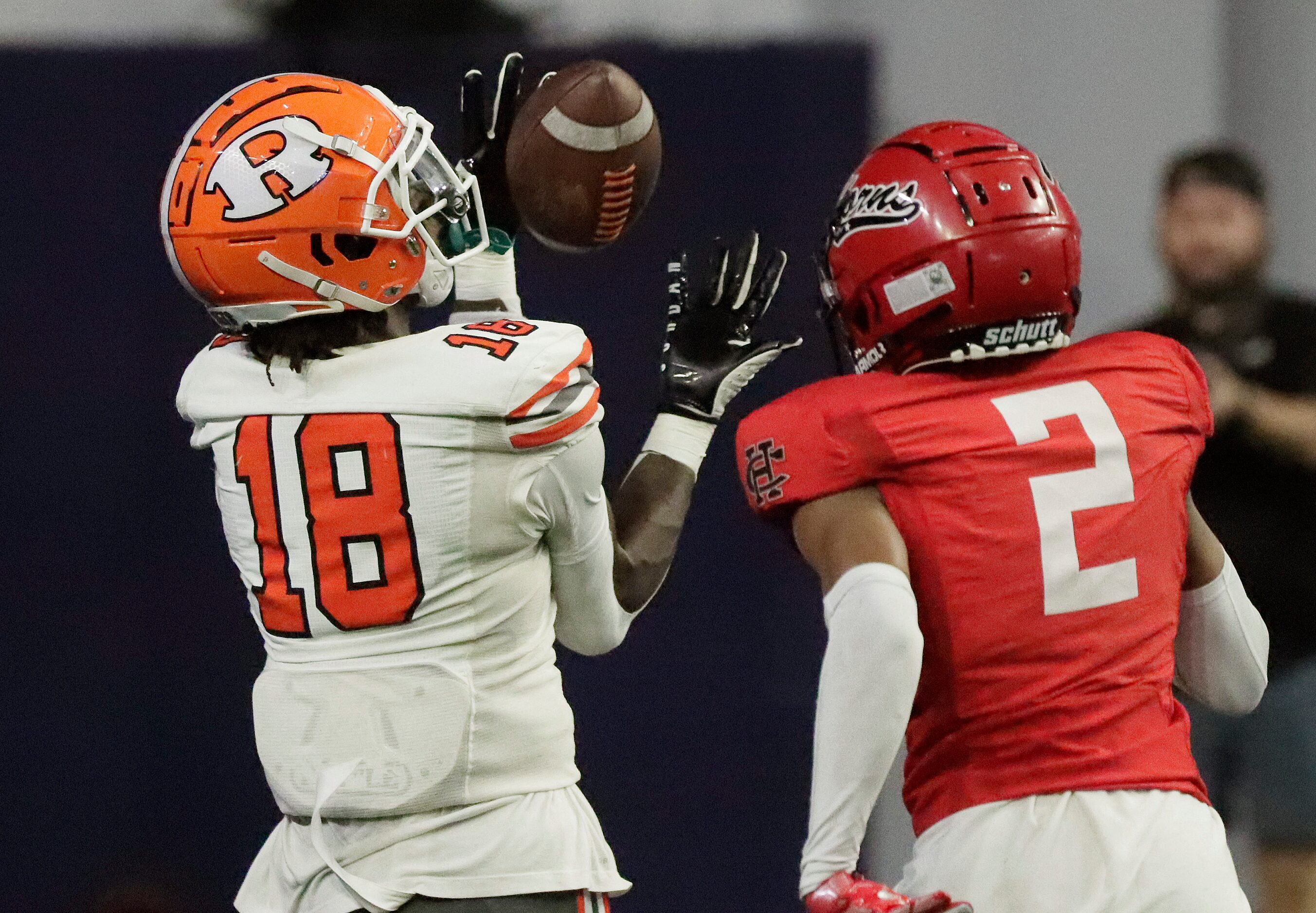 Rockwall High School wide receiver Matthew Young (18) catches a touchdown pass behind Cedar...