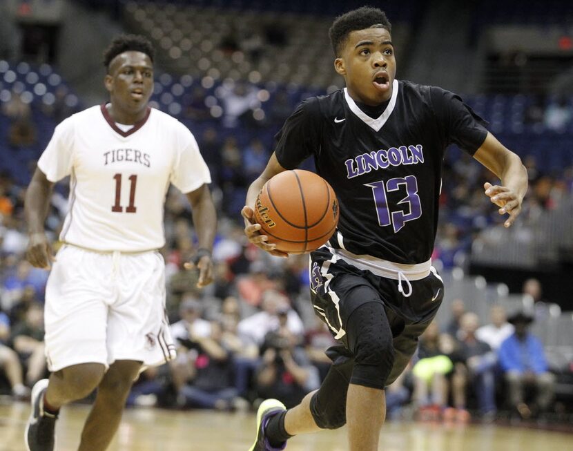 Dallas Lincoln's Kennedy Milton (13) drives down the court ahead of Silsbee's Dontre Thomas...