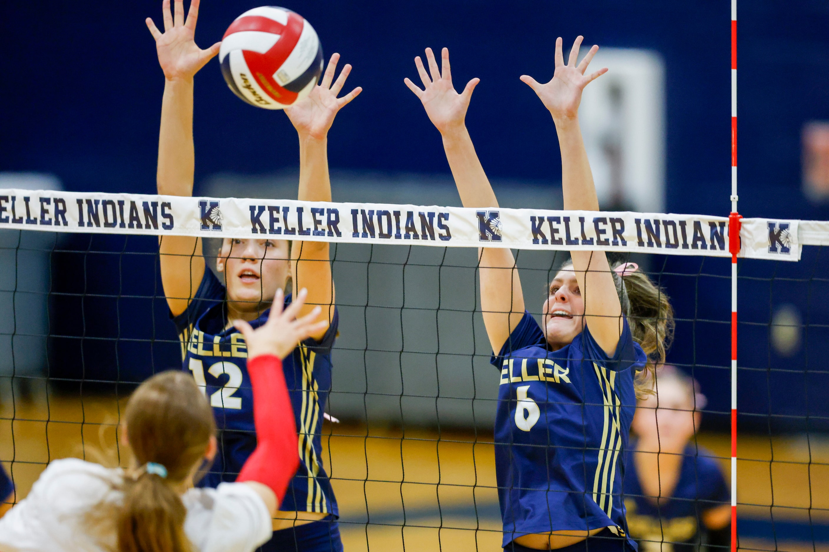 Keller's Anna Flores (12) and Haylee Wilkinson (6) try to block a hit form Justin...