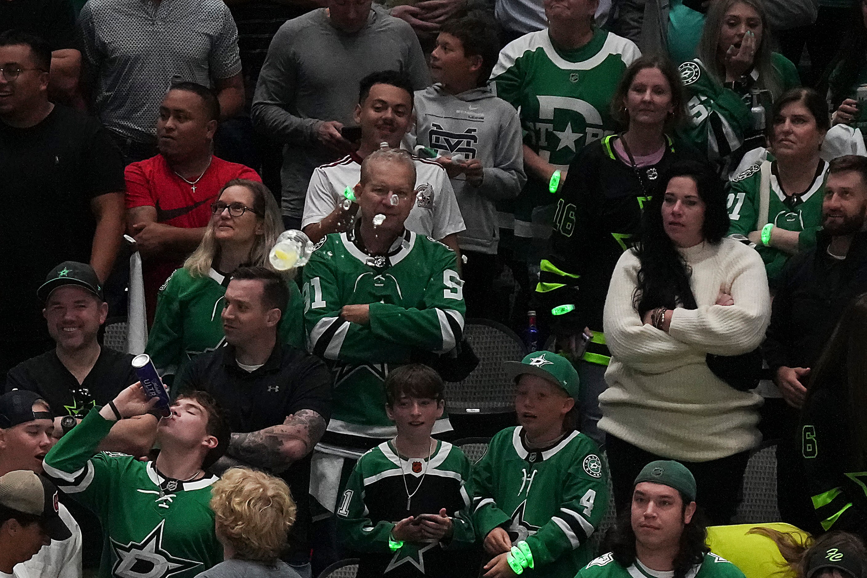 A cup is thrown to the ice by fans after Dallas Stars center Max Domi received multiple...