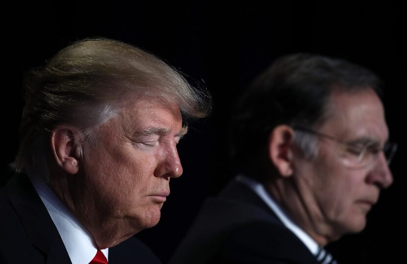 Pres. Donald Trump bows his head in prayer while attending the National Prayer Breakfast...