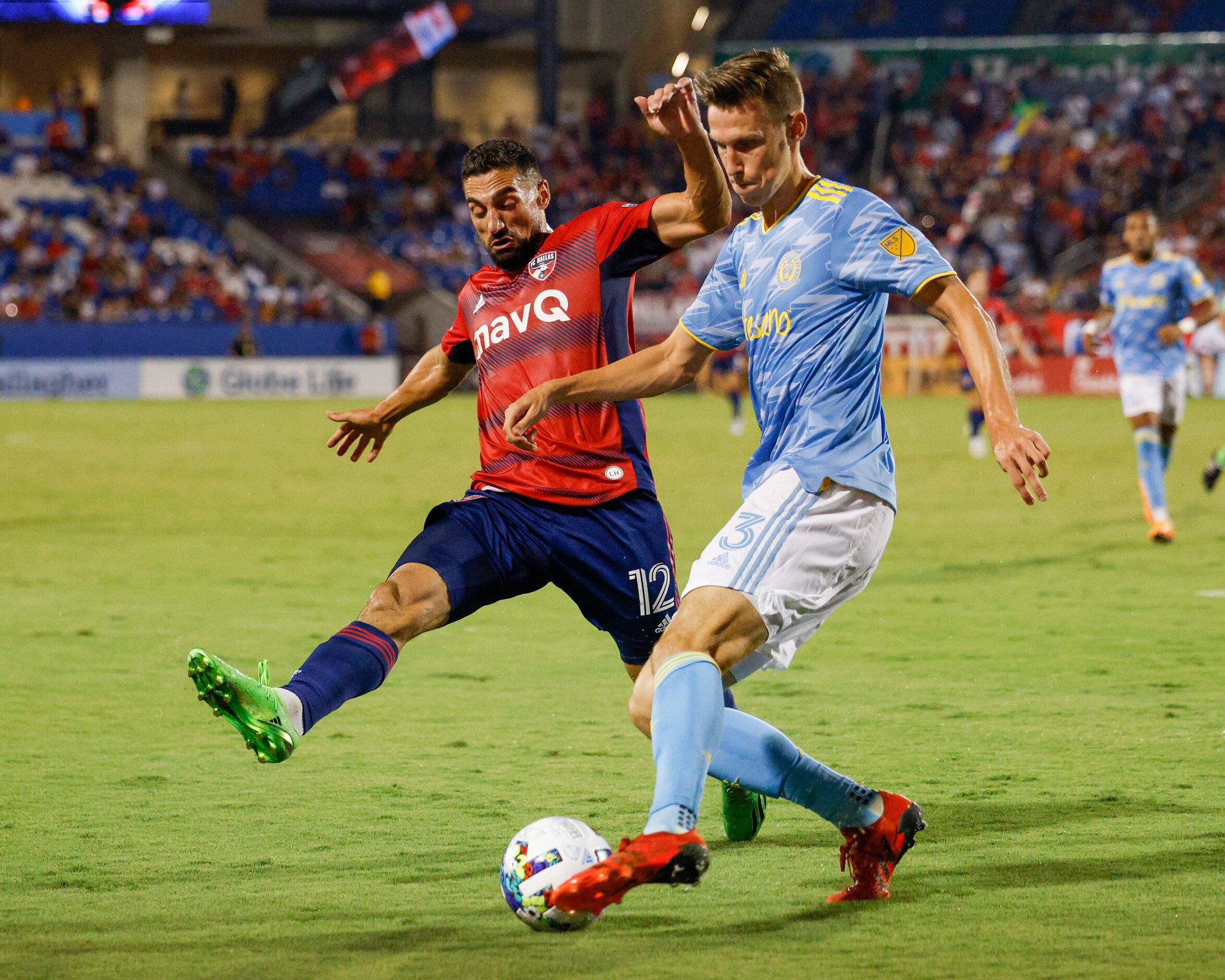 FC Dallas midfielder Sebastian Lletget (12) attempts a slide tackle on Philadelphia Union...